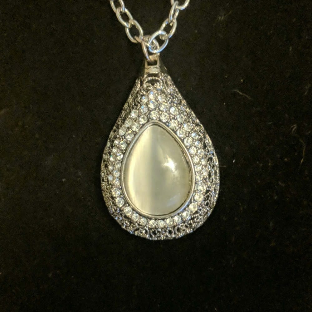 Large grey and silver tone pendant with crystals